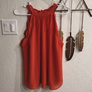 Red blouse size XL fits more like a large